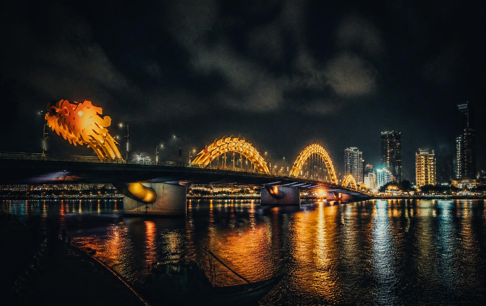 Da Nang at night with the Dragon Bridge glowing over the Han River